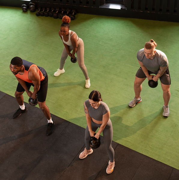 full-shot-people-training-together-gym
